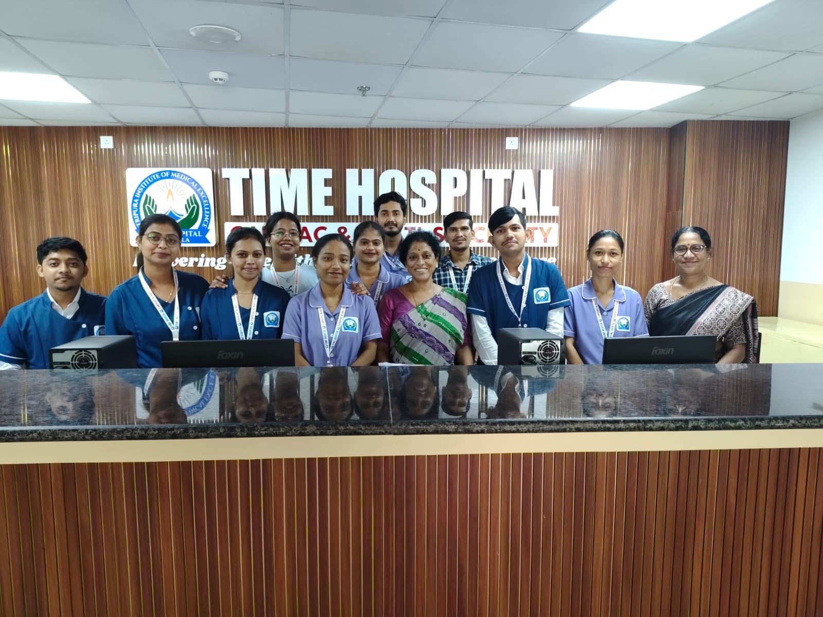 TIME Hospital front-desk team at the reception counter
